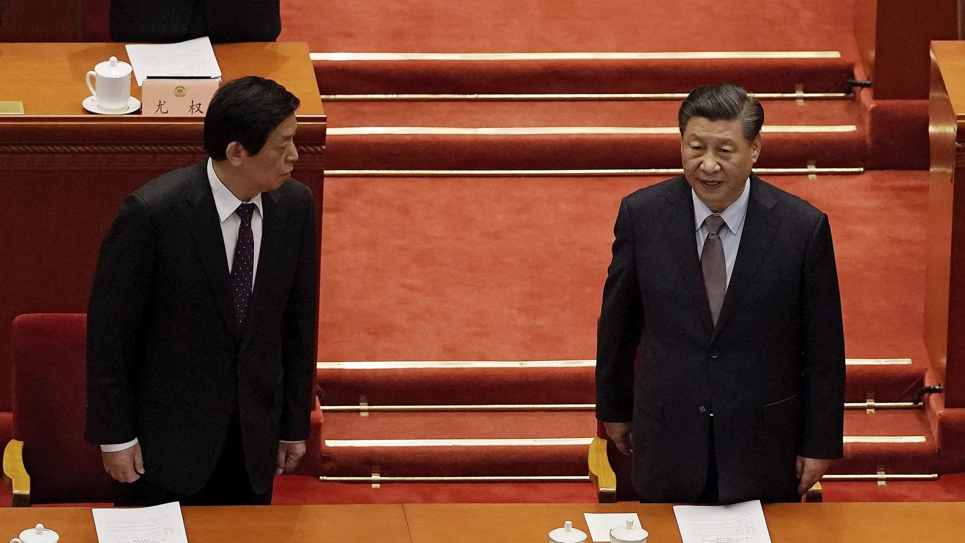 Chinese President Xi Jinping, right, chats with Li Zhanshu, Chairman of National People's Congress, as they arrive for the opening session of Chinese People's Political Consultative Conference (CPPCC) at the Great Hall of the People in Beijing, Thursday, March 4, 2021. (AP Photo/Andy Wong)
