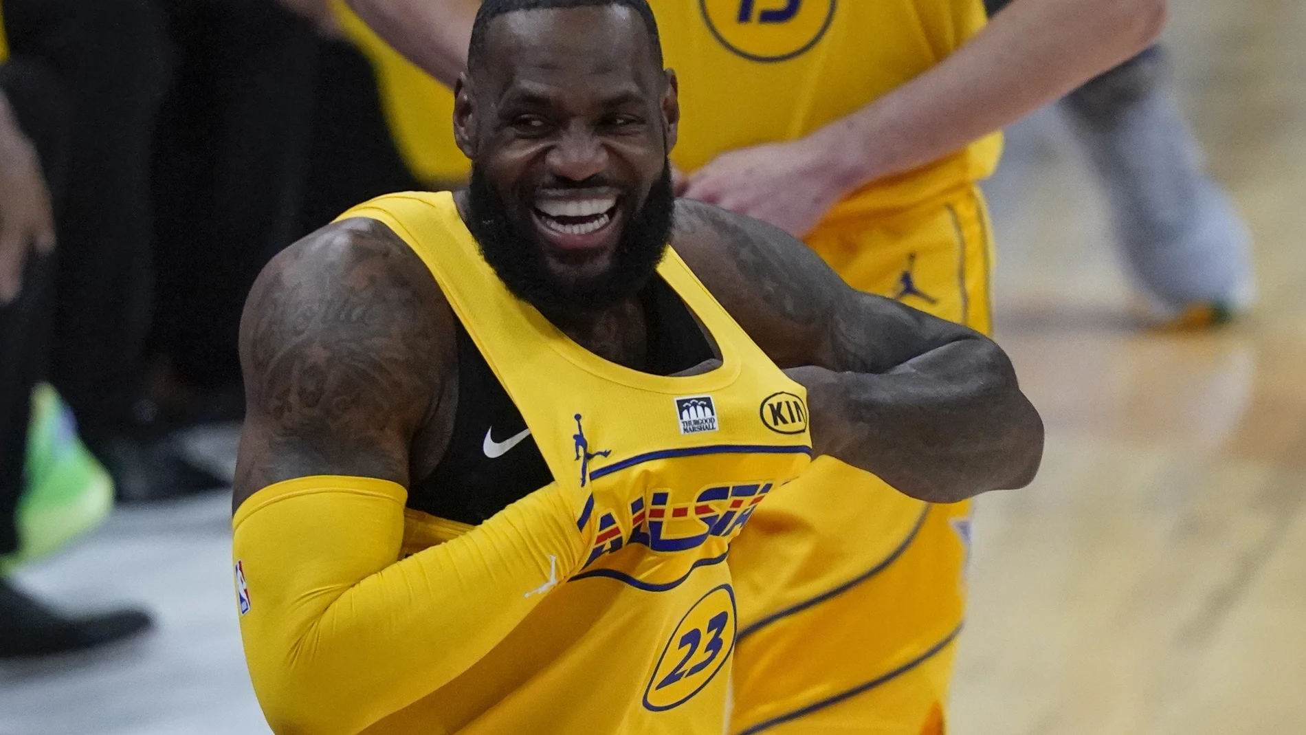 Los Angeles Lakers forward LeBron James walks onto the court for the first half of basketball's NBA All-Star Game in Atlanta, Sunday, March 7, 2021. (AP Photo/Brynn Anderson)