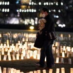 Tokyo (Japan), 10/03/2021.- A visitor walks through paper lanterns lit for the victims of the 2011 Great East Japan Earthquake in Tokyo, Japan, 10 March 2021, on the eve of the 10th anniversary of the devastating earthquake and tsunami. More than 2000 candles with messages are displayed until 11 March 2021 to mark the 10th anniversary of the Great East Japan Earthquake. (Terremoto/sismo, Japón, Tokio) EFE/EPA/FRANCK ROBICHON