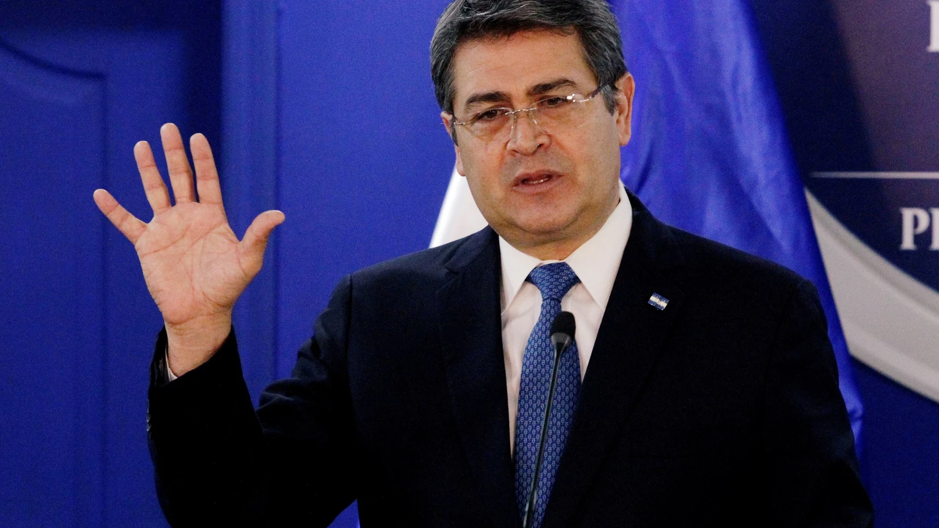 FILE PHOTO: Honduras' president, Juan Orlando Hernandez, speaks during a joint message with U.S. Department of Homeland Security (DHS) acting Secretary Chad Wolf (not pictured), at the Presidential House in Tegucigalpa, Honduras January 9, 2020. REUTERS/Jorge Cabrera/File Photo