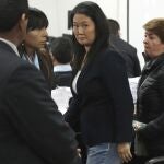 FILE - In this Oct. 24, 2018 file photo, Keiko Fujimori, the daughter of Peru's former President Alberto Fujimori, and leader of the opposition party, center, attends a hearing in Lima, Peru. A Peruvian prosecutor requested on Thursday, March 11, 2021, for 30 years in prison for Keiko Fujimori and the dissolution of her political party for allegedly laundering money from the Brazilian construction company Odebrecht. (AP Photo/Martin Mejia, File)
