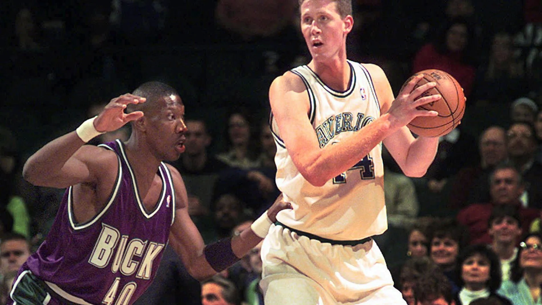 FILE- In this Nov. 22, 1997, file photo, Dallas Mavericks' Shawn Bradley (44) looks to pass as Milwaukee Bucks' Ervin Johnson (40) defends during the first quarter of an NBA basketball game at the Reunion Arena in Dallas. Former NBA player Shawn Bradley was paralyzed when he was struck from behind by a vehicle while riding a bike near his Utah home, saying in a statement nearly two months after the accident he intended to bring awareness to bicycle safety. (AP Photo/LM Otero, File)