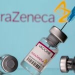 FILE PHOTO: Vials labelled "Astra Zeneca COVID-19 Coronavirus Vaccine" and a syringe are seen in front of a displayed AstraZeneca logo in this illustration photo