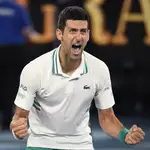 File-This Feb. 21, 2021, file photo shows Serbia&#39;s Novak Djokovic celebrating after defeating Russia&#39;s Daniil Medvedev in the men&#39;s singles final at the Australian Open tennis championship in Melbourne, Australia. No. 1-ranked Djokovic has pulled out of the upcoming Miami Open, joining Rafael Nadal and Roger Federer on the sideline. Djokovic says that with the current coronavirus restrictions, he needs to find balance in his time on tour and at home. (AP Photo/Andy Brownbill, File)
