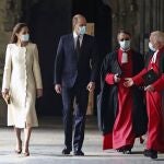 Britain's Prince William and Kate, Duchess of Cambridge with Dean of Westminster The Very Reverend Dr David Hoyle, right, and Paul Baumann, Receiver General and Chapter Clerk arrive for a visit to the vaccination center at Westminster Abbey, London, Tuesday, March 23, 2021 to pay tribute to the efforts of those involved in the Covid-19 vaccine rollout. The U.K. is marking a national day of reflection Tuesday a year after British Prime Minister Boris Johnson first announced that the country would go into lockdown to slow the fast-spreading coronavirus. (Aaron Chown/Pool Photo via AP)