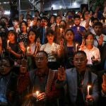 Myanmar citizens living in India and members of Mizo Zirlai Pawl (MZP), a student organisation from India's Mizoram state, hold a candle vigil to pay tribute to people who died in Myanmar after the military coup, in New Delhi, India, March 23, 2021. REUTERS/Anushree Fadnavis