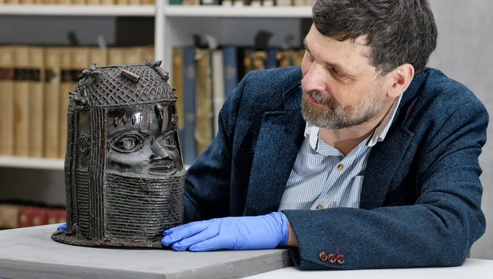 Neil Curtis, Head of Museums and Special collections is seen with one of the Benin bronze depicting the Oba of Benin at The Sir Duncan Rice Library in Aberdeen