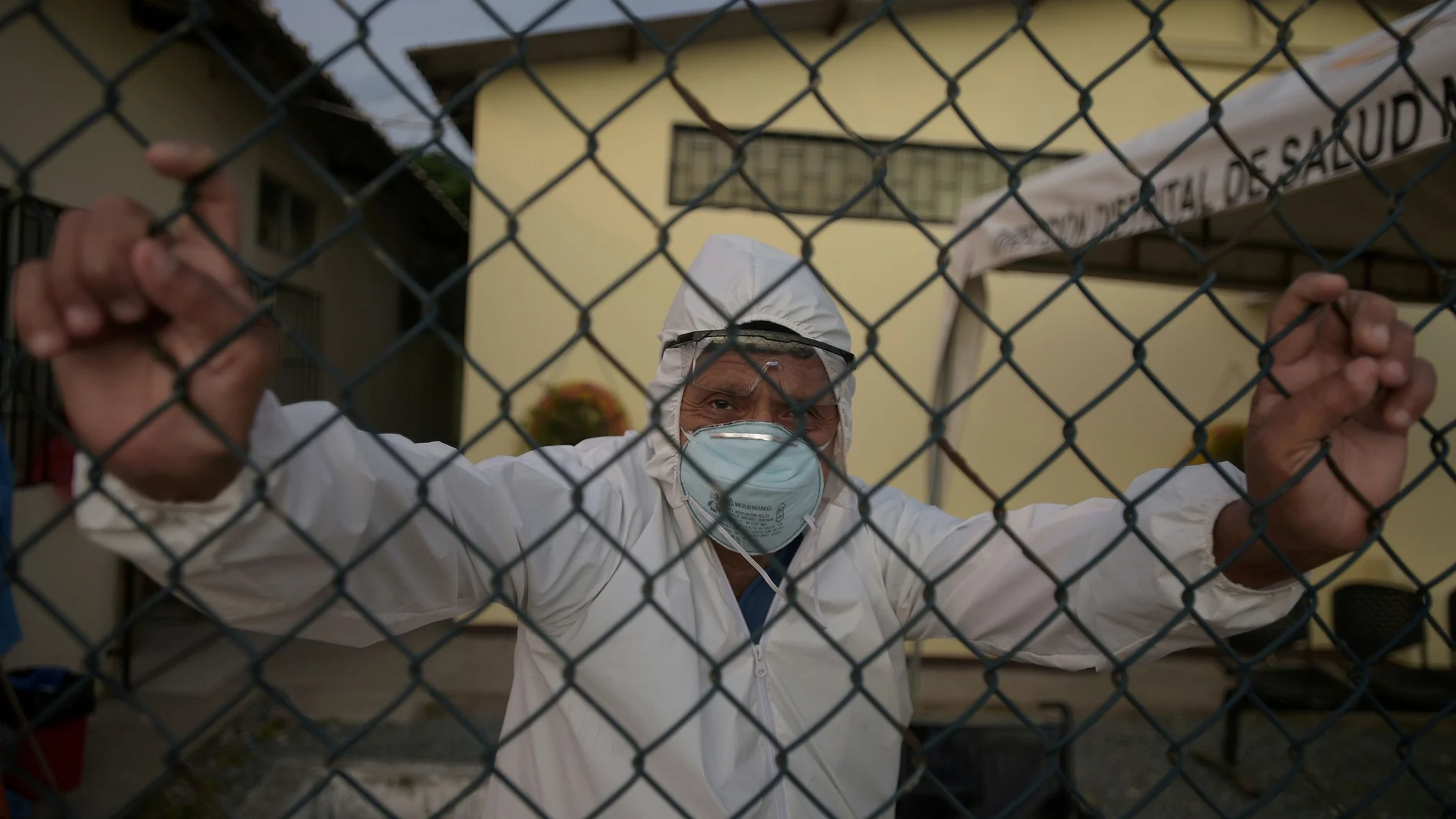 FILE PHOTO: Doctor Bolivar Jalca, who is treating patients experiencing symptoms consistent with COVID-19, poses for a photograph outside Manglaralto Hospital, during the coronavirus disease (COVID-19) outbreak, in Manglaralto, Ecuador, May 2, 2020. REUTERS/Vicente Gaibor del Pino/File Photo