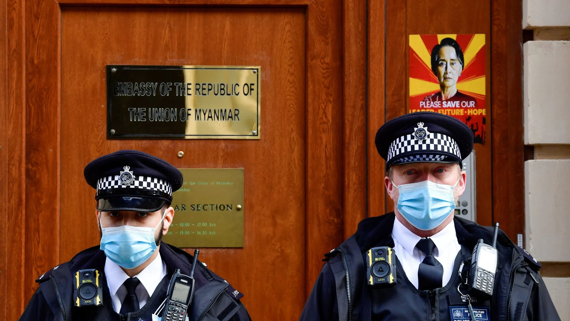 Police officers stand guard outside the Myanmar Embassy in London, Britain, April 8, 2021. REUTERS/Toby Melville