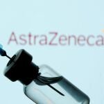 FILE PHOTO: A vial and sryinge are seen in front of a displayed AstraZeneca logo in this illustration taken January 11, 2021. REUTERS/Dado Ruvic/Illustration/File Photo