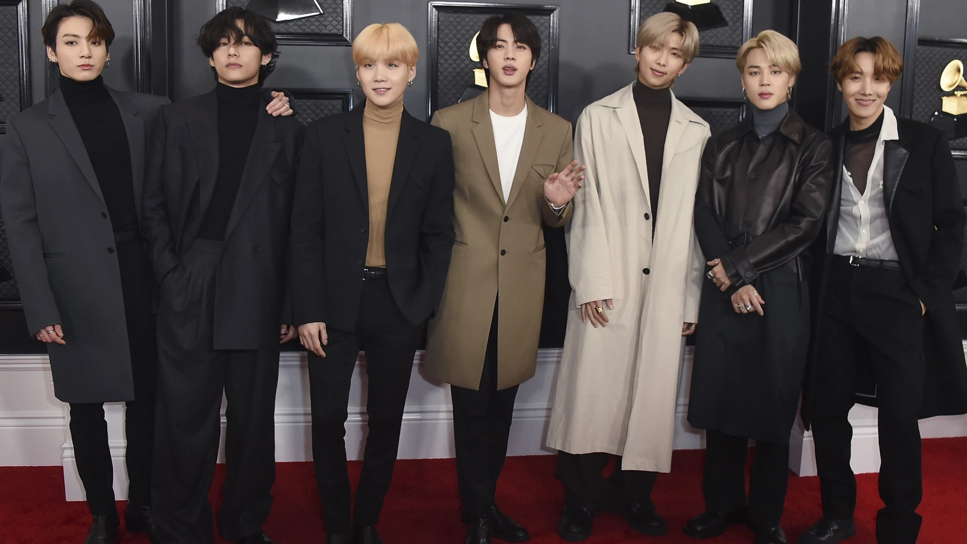 FILE - BTS arrives at the 62nd annual Grammy Awards in Los Angeles on Jan. 26, 2020. The popular band will perfrom at this month's Grammy Awards. (Photo by Jordan Strauss/Invision/AP, File)