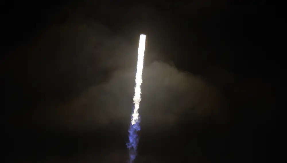The flame from the booster on the SpaceX Falcon 9, with the Crew Dragon capsule, illuminates a cloud during lift off from Launch Complex 39A Friday, April 23, 2021, at the Kennedy Space Center in Cape Canaveral, Fla. Four astronauts will fly on the SpaceX Crew-2 mission to the International Space Station. (AP Photo/Chris O'Meara)