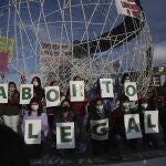 FILE - In this Sept. 28, 2020 file photo, women hold letters forming the phrase "Legal Abortion Now" during an abortion-rights protest in Quito, Ecuador. The South American countryâ€™s constitutional court ruled on Wednesday, April 28, 2021, in favor of decriminalizing abortion in the case of rape.(AP Photo/Dolores Ochoa, File)