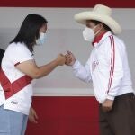 Presidential candidates, Keiko Fujimori of the Popular Force party, and Pedro Castillo of the Free Peru party, fist bump at the end of a presidential debate, in Chota, Peru, Saturday, May 1, 2021. The second round candidates arrived in the small town in the country's northern highlands for their first presidential debate ahead of the June 6th runoff election. (AP Photo/Francisco Vigo)