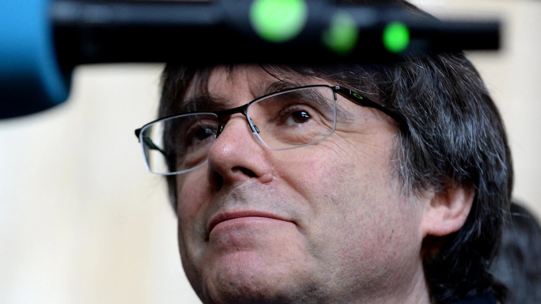 Former Catalan leader Carles Puigdemont talks to the media at the Justice Palace in Brussels, Belgium