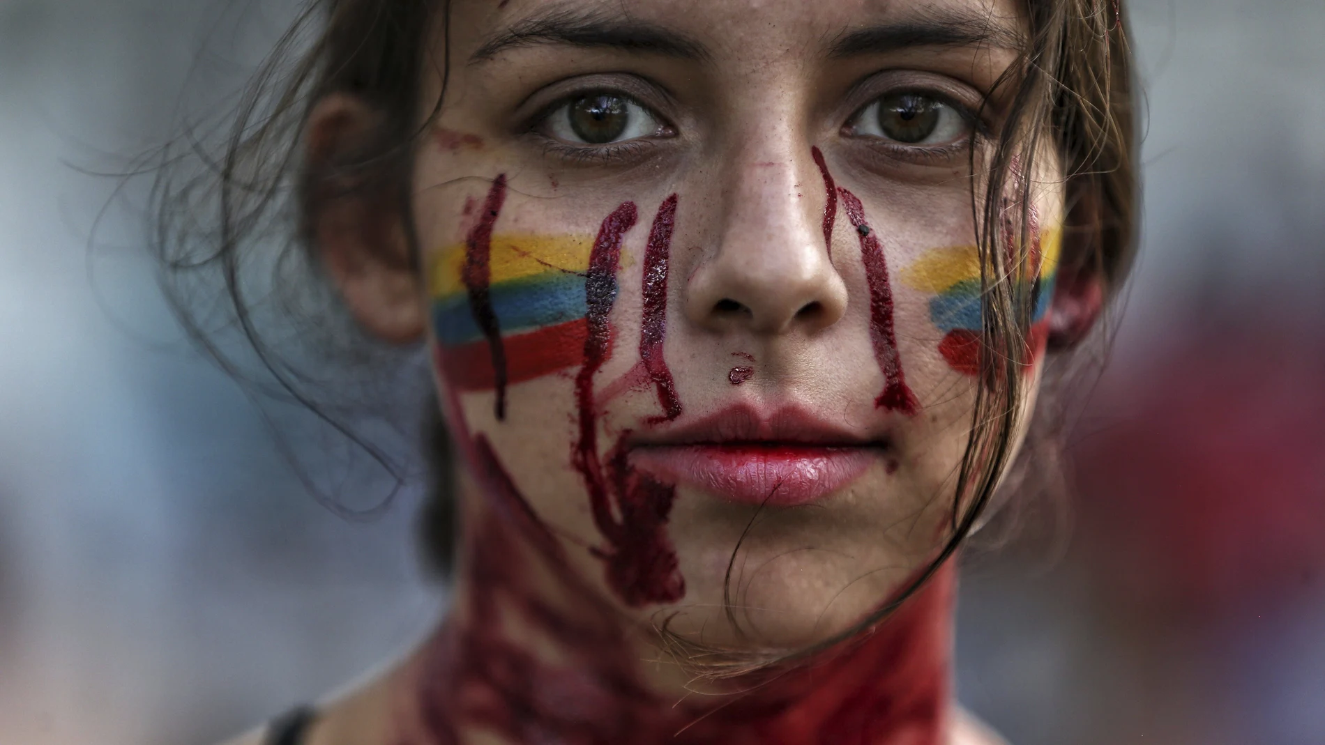 A student performs a play called "Who killed them" during anti-government protests in Cali, Colombia, Tuesday, May 11, 2021. Colombians have protested across the country against a government they feel has long ignored their needs, allowed corruption to run rampant and is so out of touch that it proposed tax increases during the coronavirus pandemic. (AP Photo/Andres Gonzalez)