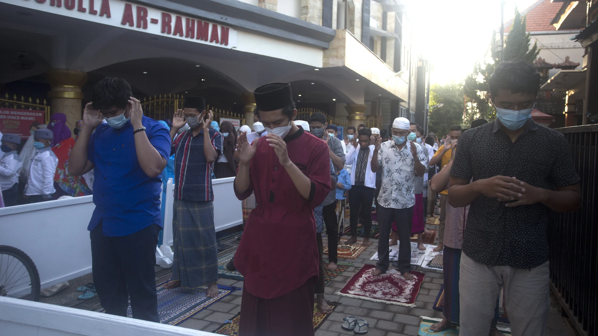 Muslims wearing face masks offer the Eid al-Fitr prayer in Bali, Indonesia Thursday, May 13, 2021. Indonesian Muslims perform Eid al-Fitr prayer that marks the end of the holy fasting month of Ramadan. (AP Photo/Firdia Lisnawati)