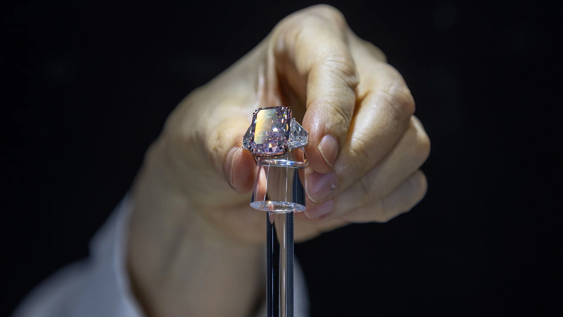 Hong Kong (China), 20/05/2021.- A woman holds the Sakura Diamond during preview at Christie's in Hong Kong, China, 20 May 2021. The 15.81 Carat Fancy Vivid Purple Pink Internally Flawless Type lla Diamond Ring will be auctioned in Hong Kong on 23 May 2021 for an estimated 25 million to 38 million US dollars. EFE/EPA/JEROME FAVRE