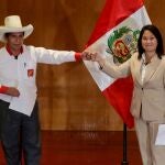 FILE PHOTO: Peruvian presidential candidates Pedro Castillo and Keiko Fujimori, who will face each other in a run-off vote on June 6, gesture after signing a "Pact for Democracy," in Lima, Peru May 17, 2021. REUTERS/Sebastian Castaneda/File Photo