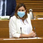 La diputada popular María José Catalá ha sido la encargada de defender la iniciativa para pedir que el BOE rectifique sobre el origen de las bandas valencianas