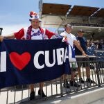 May 31, 2021; West Palm Beach, Florida, USA; A fan of the Cuban team holds a flag during the WBSC Baseball Americas Qualifier series of baseball games between Cuba and Venezuela at The Ballpark of the Palm Beaches. Mandatory Credit: Jasen Vinlove-USA TODAY Sports