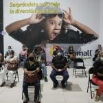 Residents sit in observation after getting shots of the AstraZeneca vaccine for COVID-19 at Mega Mall on the outskirts of Panama City, Wednesday, June 9, 2021. (AP Photo/Arnulfo Franco)