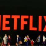 FILE PHOTO: Small toy figures are seen in front of displayed Netflix logo in this illustration taken March 19, 2020. REUTERS/Dado Ruvic/Illustration/File Photo