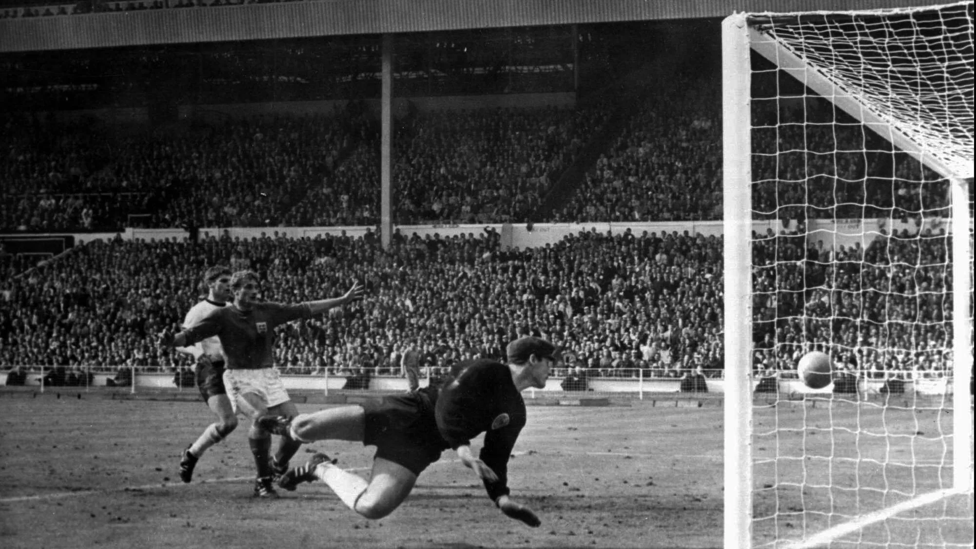 FILE - In this July 30, 1966 file photo, a shot from Geoff Hurst bounces down from the West Germany crossbar during the World Cup final at London's Wembley Stadium. The linesman gave it as a goal and England went to to win 4-2. England won its only World Cup title by beating West Germany in London in a match that produced an enduring moment of controversy that is still the subject of debate. In extra time with the scored even at 2-2, Alan Ball crossed to England teammate Geoff Hurst, who turned and shot. The ball thumped down from the underside of the West German crossbar and Roger Hunt raised his arms to proclaim the ball bounced over the goal line. (AP Photo/File)