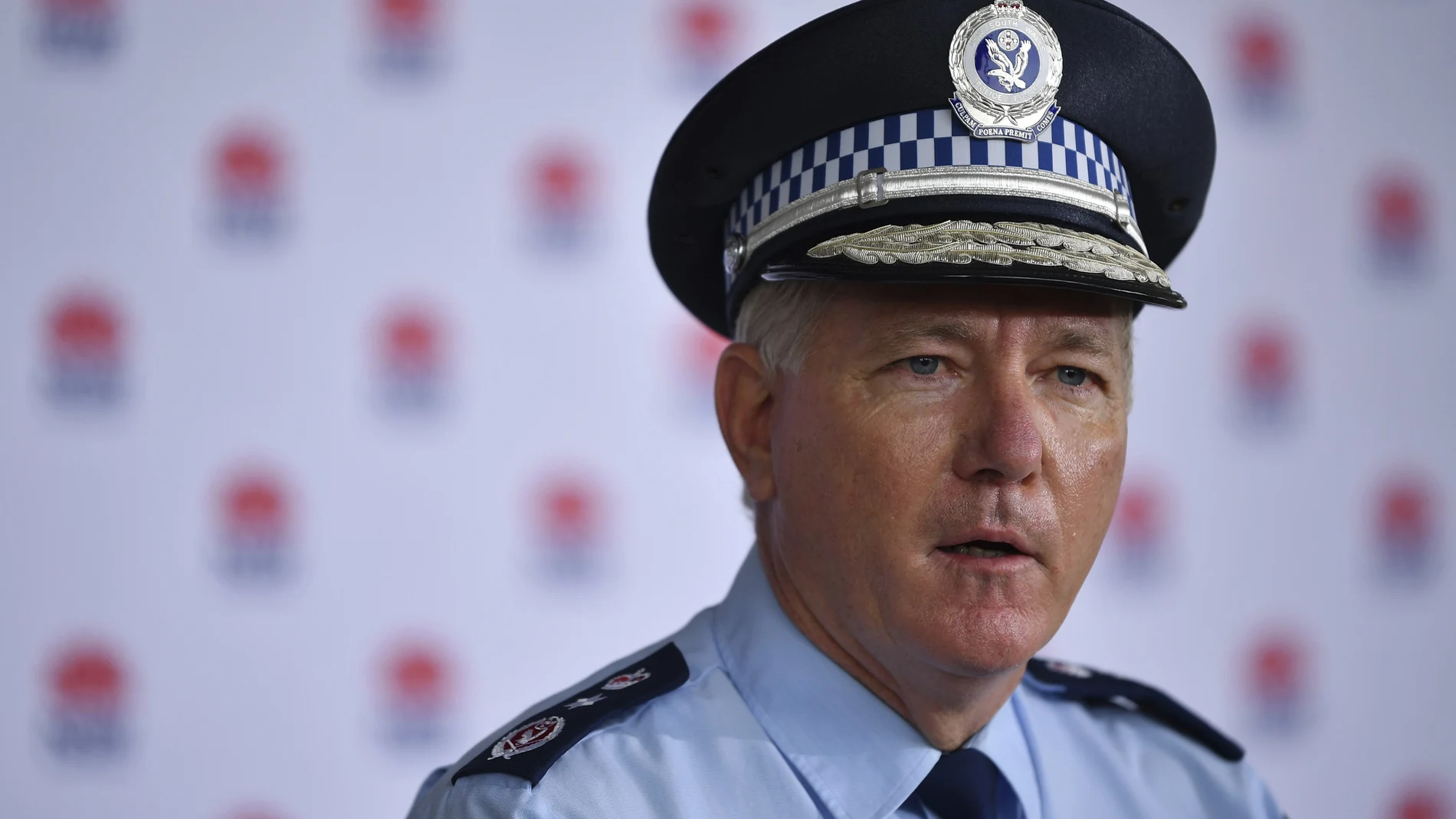 New South Wales Police Commissioner Mick Fuller speaks to media during a COVID-19 update in Sydney, Monday, June 28, 2021. Two naked men were rescued by emergency services from an Australian forest after they were startled by a deer while nude sunbathing on a beach and became lost, police say. (Joel Carrett/AAP Image via AP)