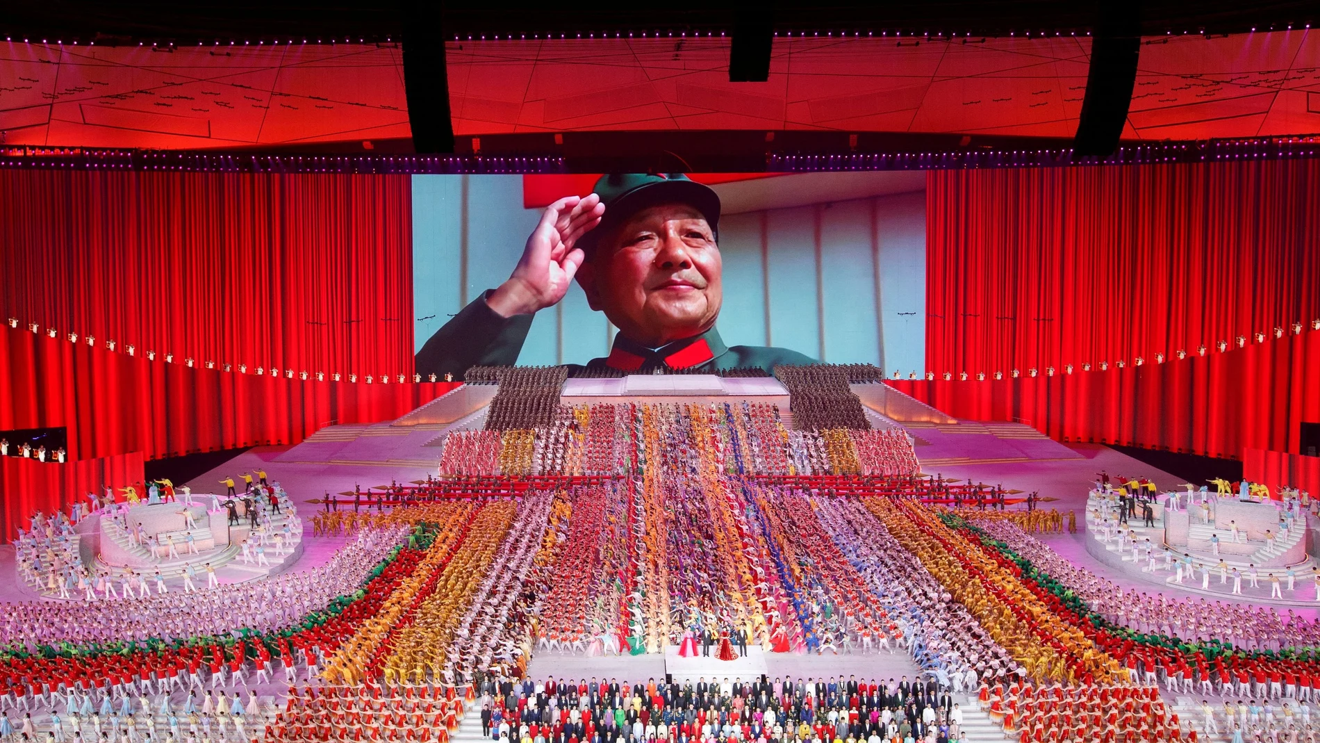A screen shows late Chinese leader Deng Xiaoping during a show commemorating the 100th anniversary of the founding of the Communist Party of China at the National Stadium in Beijing, China June 28, 2021. REUTERS/Thomas Peter