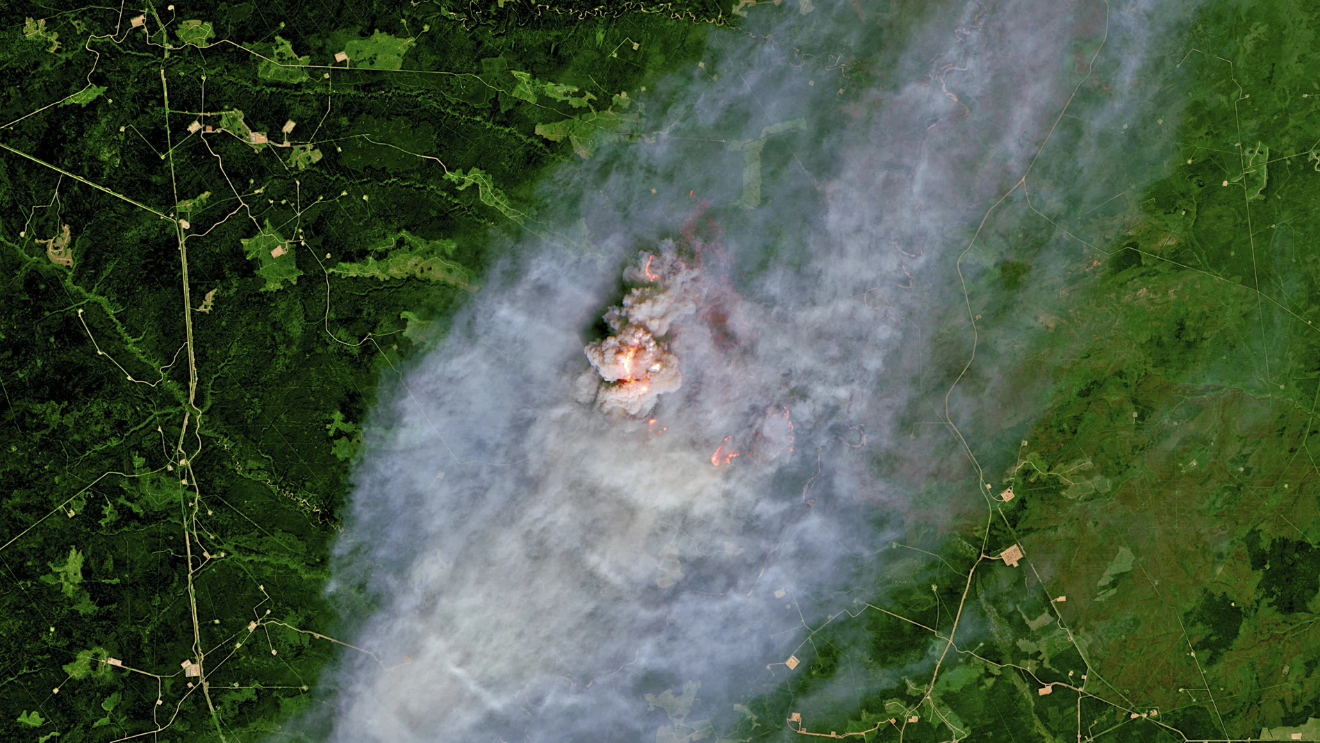 This satellite image provided by European Union, Copernicus Sentinel-2 data (processed by Spacetec) shows a wildfire burning 40 km (about 25 miles) northeast of Pink Mountain in British Columbia. (European Union, Copernicus Sentinel-2 data via AP)