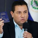 El Salvador's Labor Minister Rolando Castro shows his passport during a news conference while saying he gives up applying for a U.S. visa after being mentioned on the Engel list in San Salvador, El Salvador July 5, 2021. REUTERS/Jose Cabezas