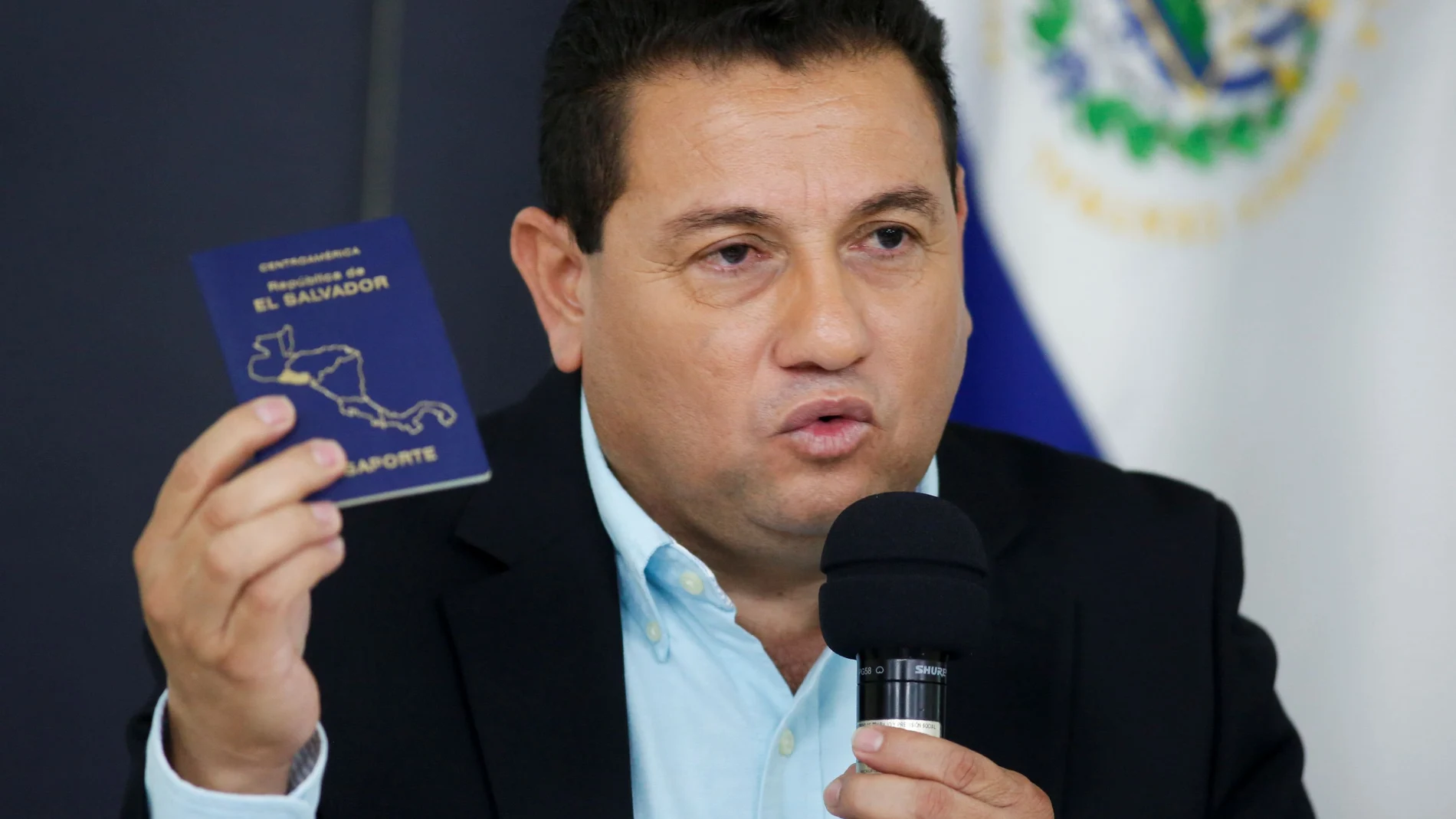 El Salvador's Labor Minister Rolando Castro shows his passport during a news conference while saying he gives up applying for a U.S. visa after being mentioned on the Engel list in San Salvador, El Salvador July 5, 2021. REUTERS/Jose Cabezas