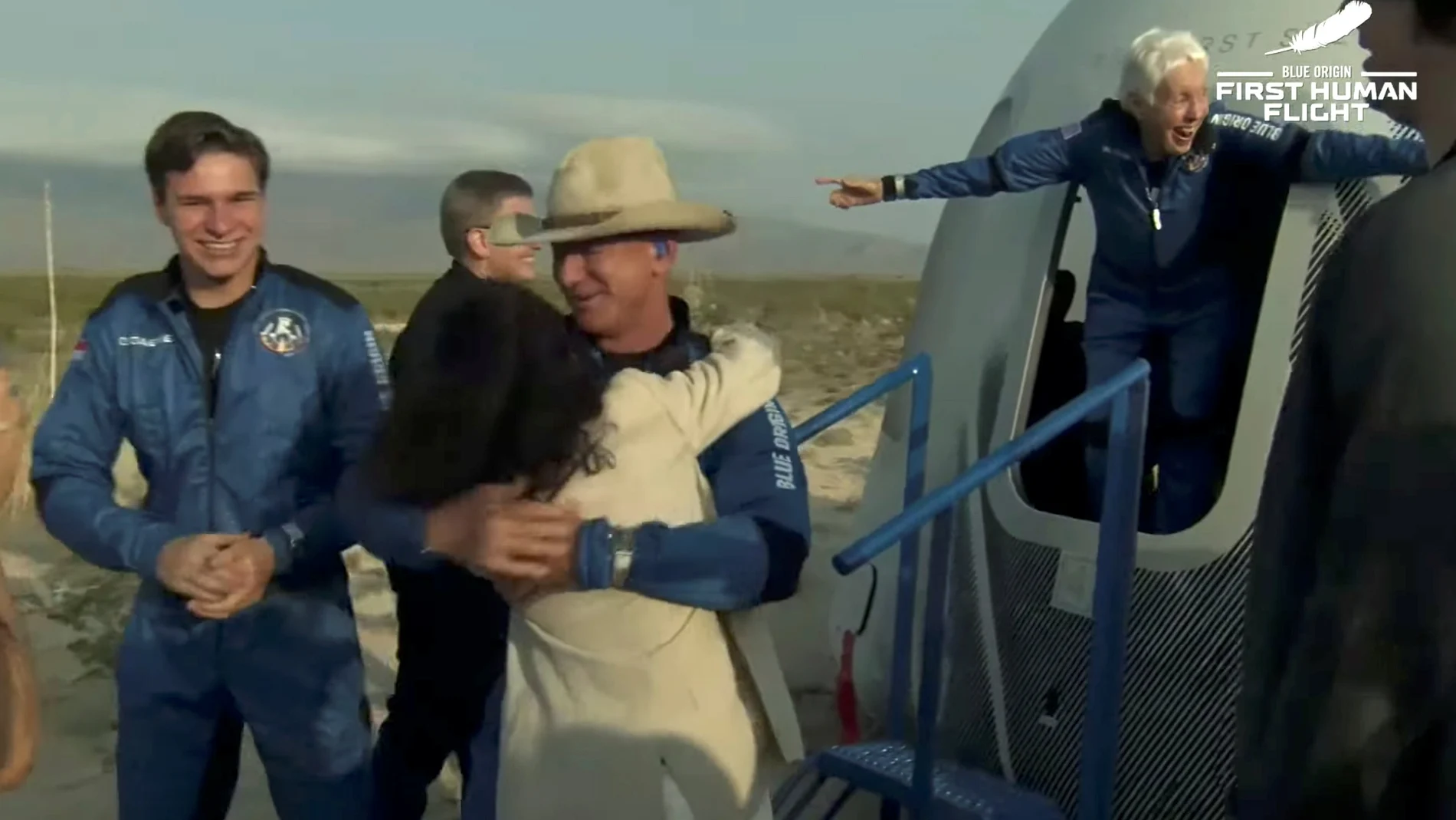 Billionaire businessman Jeff Bezos, recent Dutch high school graduate Oliver Daemen and pioneering female aviator Wally Funk emerge from their capsule after their flight aboard Blue Origin's New Shepard rocket on the world's first unpiloted suborbital flight near Van Horn, Texas, U.S., July 20, 2021 in a still image from video. Blue Origin/Handout via REUTERS. NO RESALES. NO ARCHIVES. THIS IMAGE HAS BEEN SUPPLIED BY A THIRD PARTY.