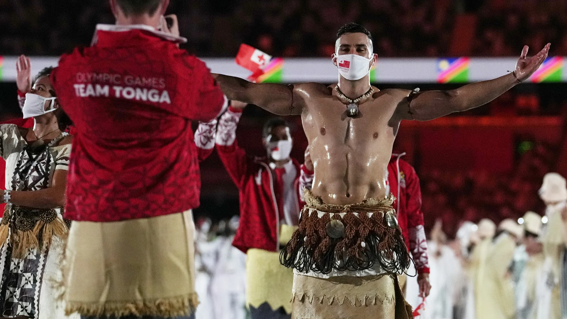 Pita Taufatofua, of Tonga, walks during the opening ceremony in the Olympic Stadium at the 2020 Summer Olympics, Friday, July 23, 2021, in Tokyo, Japan. (AP Photo/Petr David Josek)
