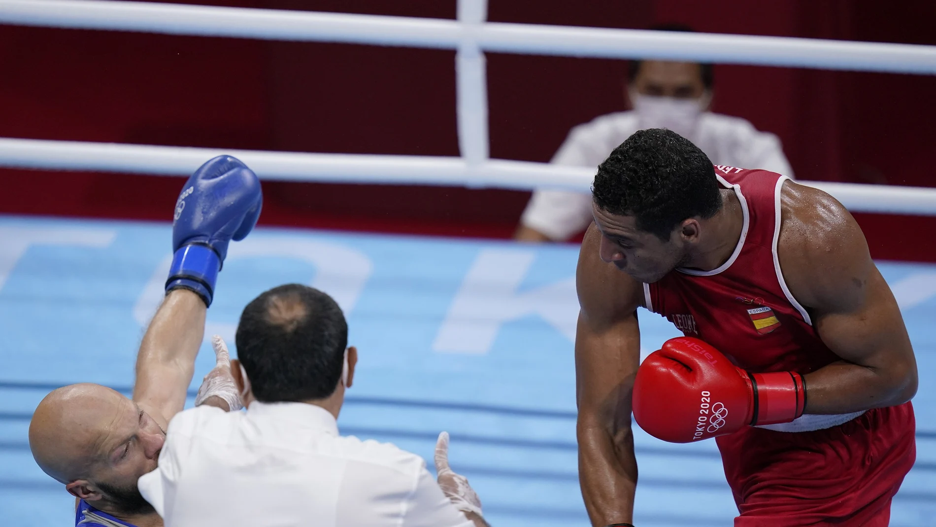Enmanuel Reyes Pla, right, punches Kazakhstan's Vassiliy Levit during their men's heavyweight 91-kg boxing match at the 2020 Summer Olympics, Tuesday, July 27, 2021, in Tokyo, Japan. (AP Photo/Frank Franklin II)