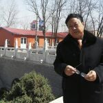 In this April 2, 2010 photo provided by the Legal Team of Dawu Group, Sun Dawu stands in Baoding in northern China's Hebei Province. A prominent Chinese pig farmer who was detained after praising lawyers during a crackdown on legal activists by President Xi Jinping's government has been se,ntenced to 18 years in prison on charges of organizing an attack on officials and other offenses. (Legal Team of Dawu Group via AP)