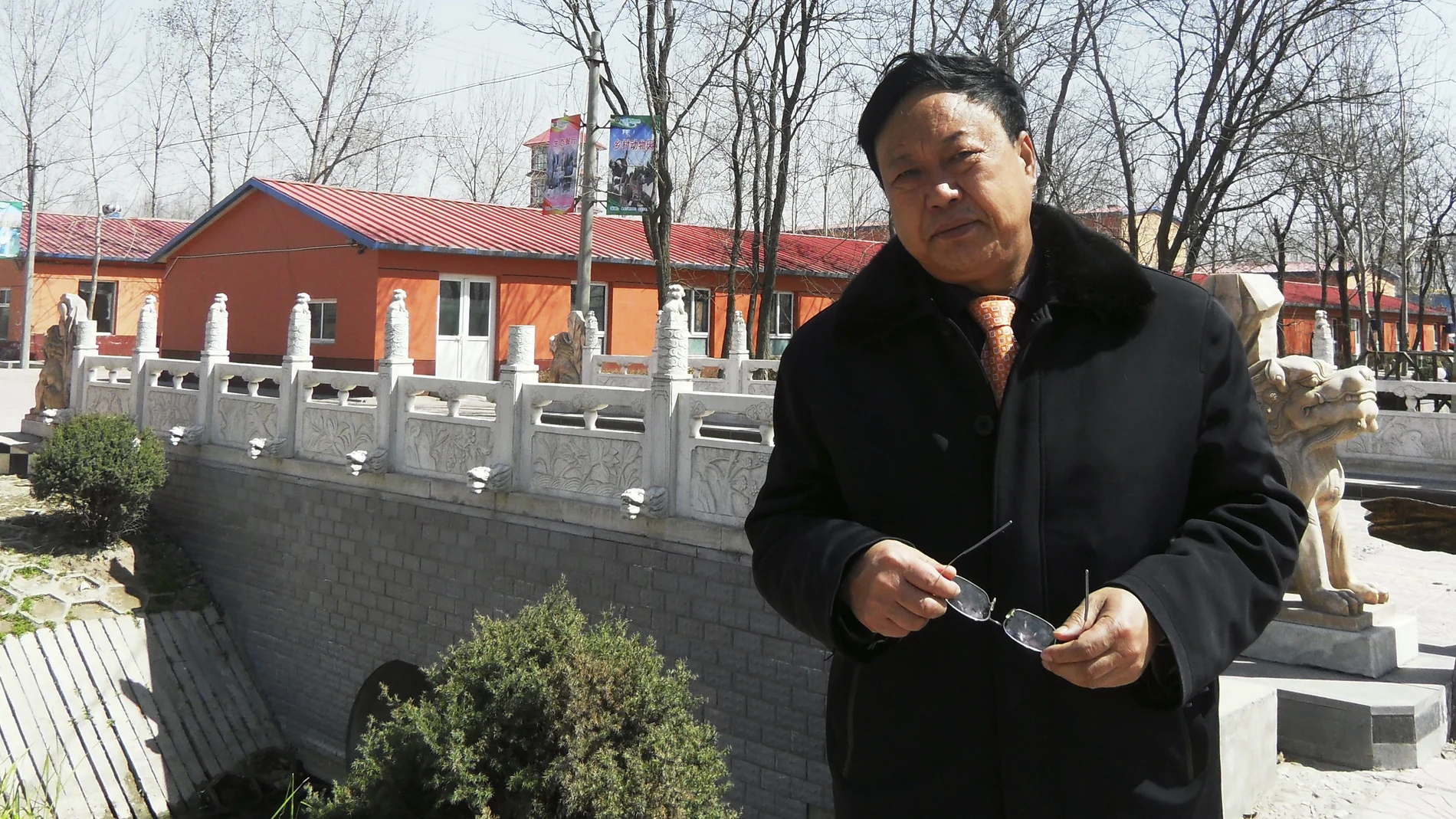 In this April 2, 2010 photo provided by the Legal Team of Dawu Group, Sun Dawu stands in Baoding in northern China's Hebei Province. A prominent Chinese pig farmer who was detained after praising lawyers during a crackdown on legal activists by President Xi Jinping's government has been se,ntenced to 18 years in prison on charges of organizing an attack on officials and other offenses. (Legal Team of Dawu Group via AP)