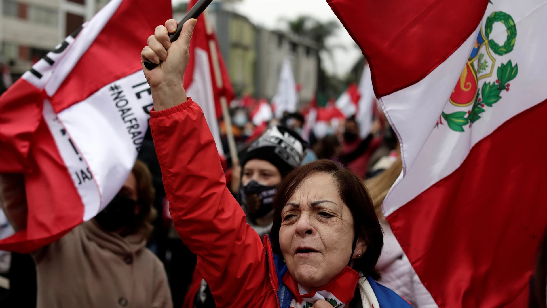 People participate in a protest against communism and Peru's new government led by President Pedro Castillo, a self-described Marxist-Leninist, in Lima, Peru August 1, 2021. REUTERS/Angela Ponce