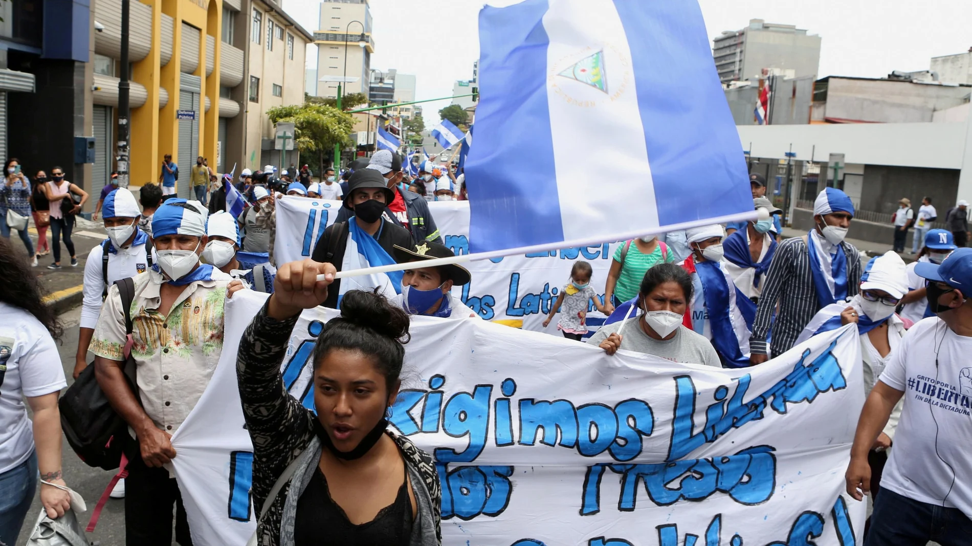 FILE PHOTO: Nicaraguans exiled in Costa Rica take part in a march named "Nicaragua no estas sola" (Nicaragua you're not alone), against the Government of Nicaraguan President Daniel Ortega and the upcoming November 7 general elections, in San Jose, Costa Rica July 18, 2021. REUTERS/Mayela Lopez NO RESALES. NO ARCHIVES/File Photo