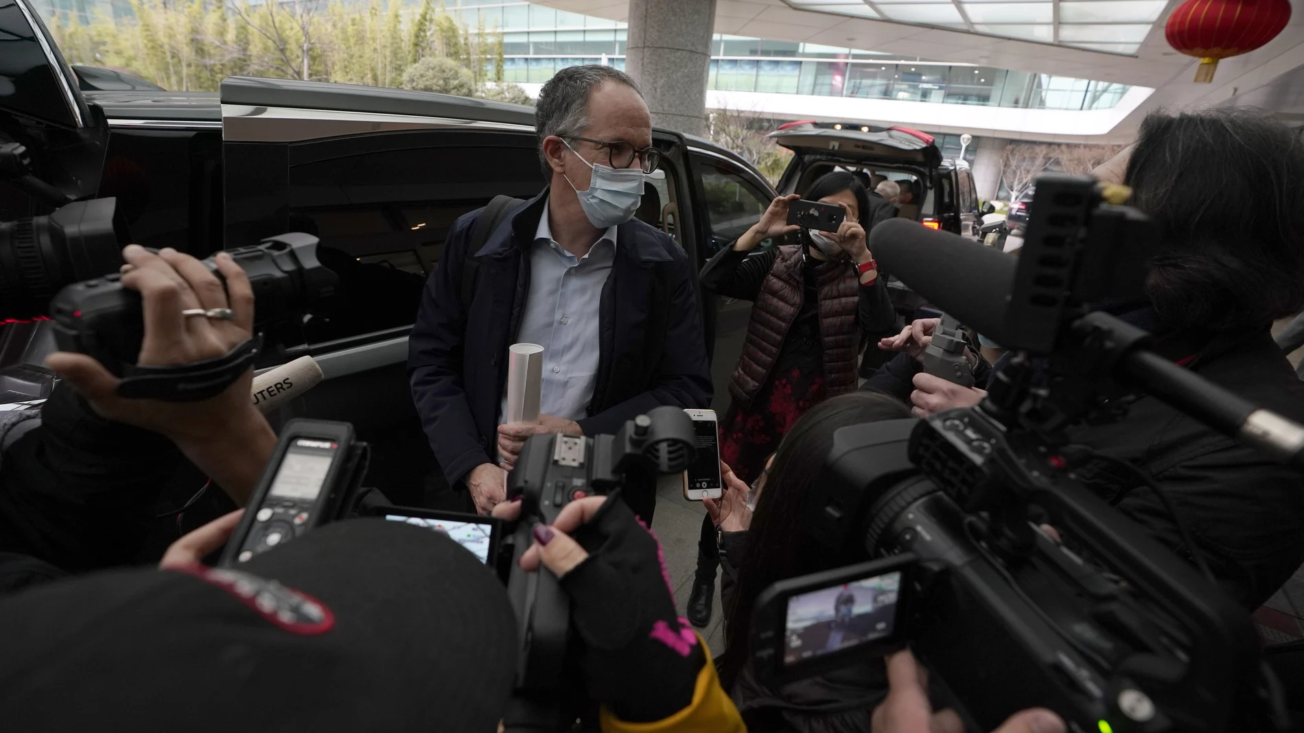 FILE - In this file photo dated Wednesday, Feb. 10, 2021, Peter Ben Embarek of a World Health Organization team speaks to journalists as he arrives at the airport to leave, at the end of their WHO mission to investigate the origins of the coronavirus pandemic in Wuhan in central China's Hubei province. When WHO traveled to China earlier this year to investigate the origins of the COVID-19 pandemic, Peter Ben Embarek said he was worried about biosafety standards at a laboratory close to the market where the first human cases were detected, according to a documentary released Thursday Aug. 12, 2021, by TV2, a Danish television channel. (AP Photo/Ng Han Guan, FILE)