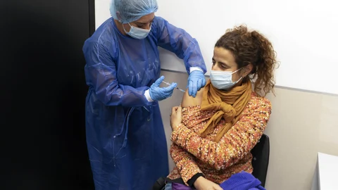 Elisa Rios gets a third dose of the Pfizer COVID-19 vaccine at the Clinicas Hospital in Montevideo, Uruguay, Monday, Aug. 16, 2021. (AP Photo/Matilde Campodonico)