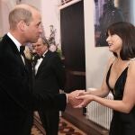 Britain's Prince William, left, speaks with actress Ana de Armas upon arrival for the World premiere of the new film from the James Bond franchise 'No Time To Die', in London, Tuesday, Sept. 28, 2021. (Chris Jackson/Pool Photo via AP)