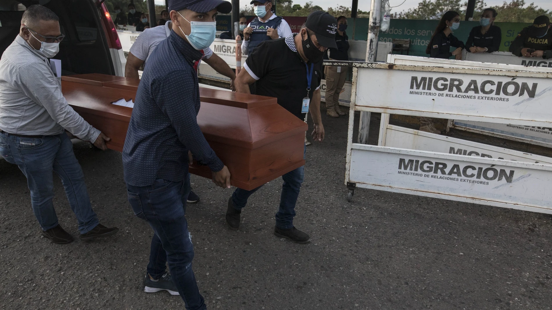 Venezuelans return to their country with the remains of a relative who died in Colombia, through the Simon Bolivar International Bridge as they leave La Parada near Cucuta, Colombia,Â Colombia, Tuesday, Oct. 5, 2021. Venezuela partially reopened its border with Colombia after closing it in 2019, a nearly three-year closure, due to political tensions. (AP Photo/Ivan Valencia)