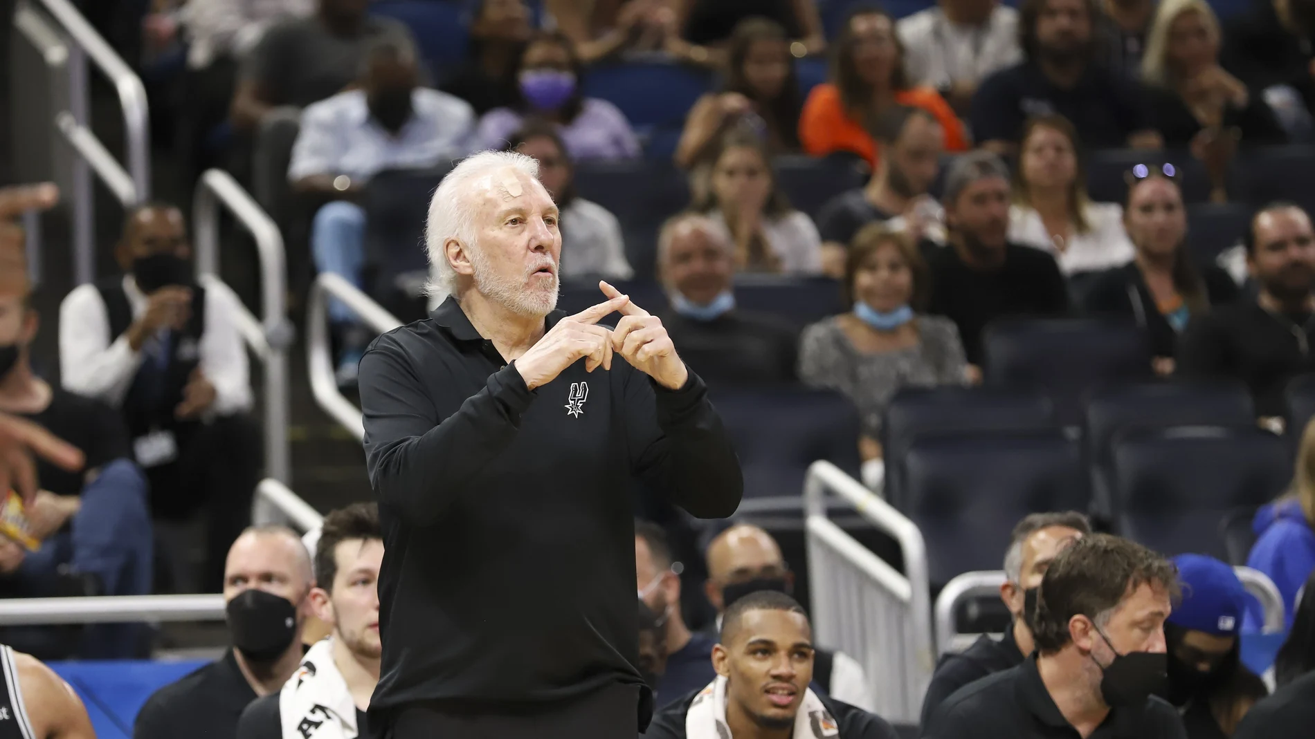 San Antonio Spurs coach Gregg Popovich calls in a play to his team during the second half of an NBA basketball game against the Orlando Magic, Sunday, Oct. 10, 2021, in Orlando, Fla. (AP Photo/Jacob M. Langston)