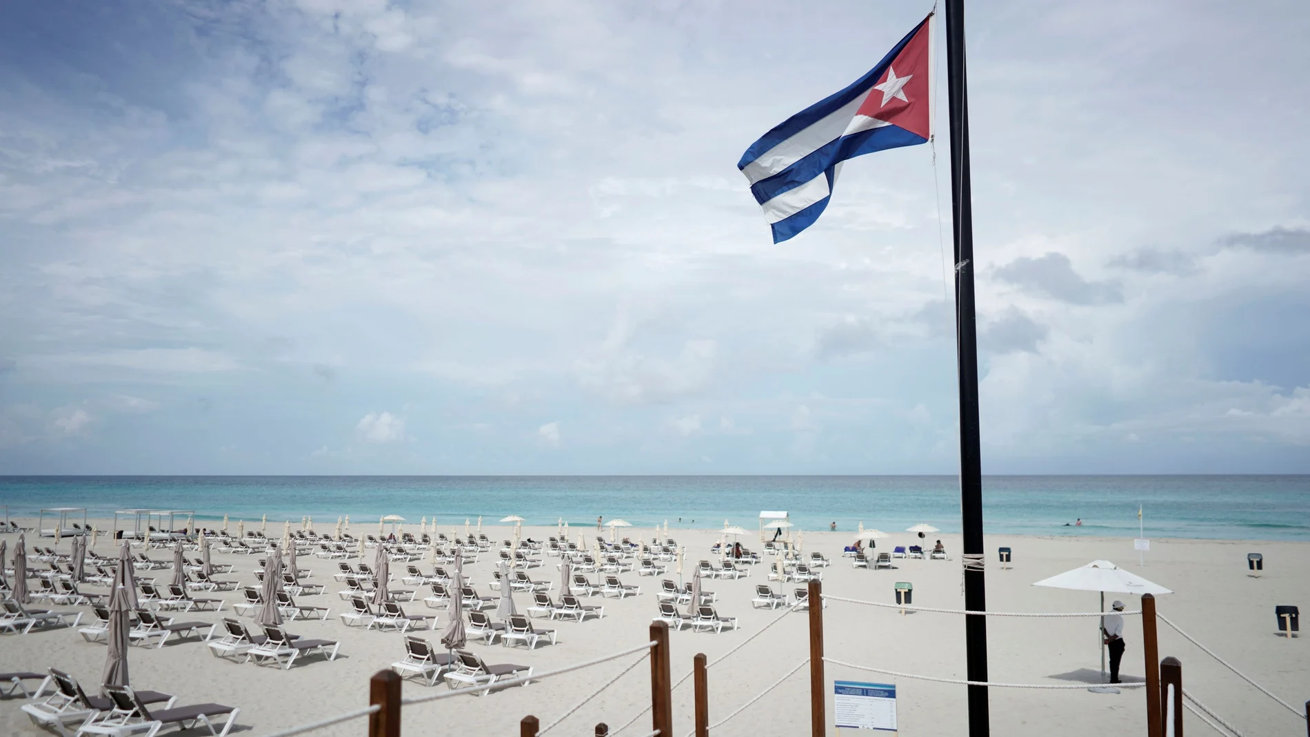 A Cuban flag is seen on the beach amid concerns about the spread of the coronavirus disease (COVID-19) in Varadero, Cuba, October 22, 2021. Picture taken on October 22, 2021. REUTERS/Alexandre Meneghini