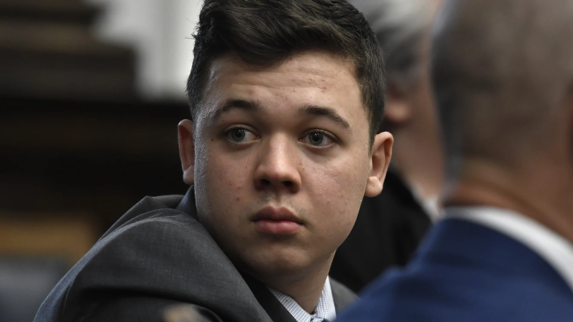 Kyle Rittenhouse looks back as attorneys discuss items in the motion for mistrial presented by his defense at the Kenosha County Courthouse in Kenosha, Wis., on Wednesday, Nov. 17, 2021. (Sean Krajacic/The Kenosha News via AP, Pool)