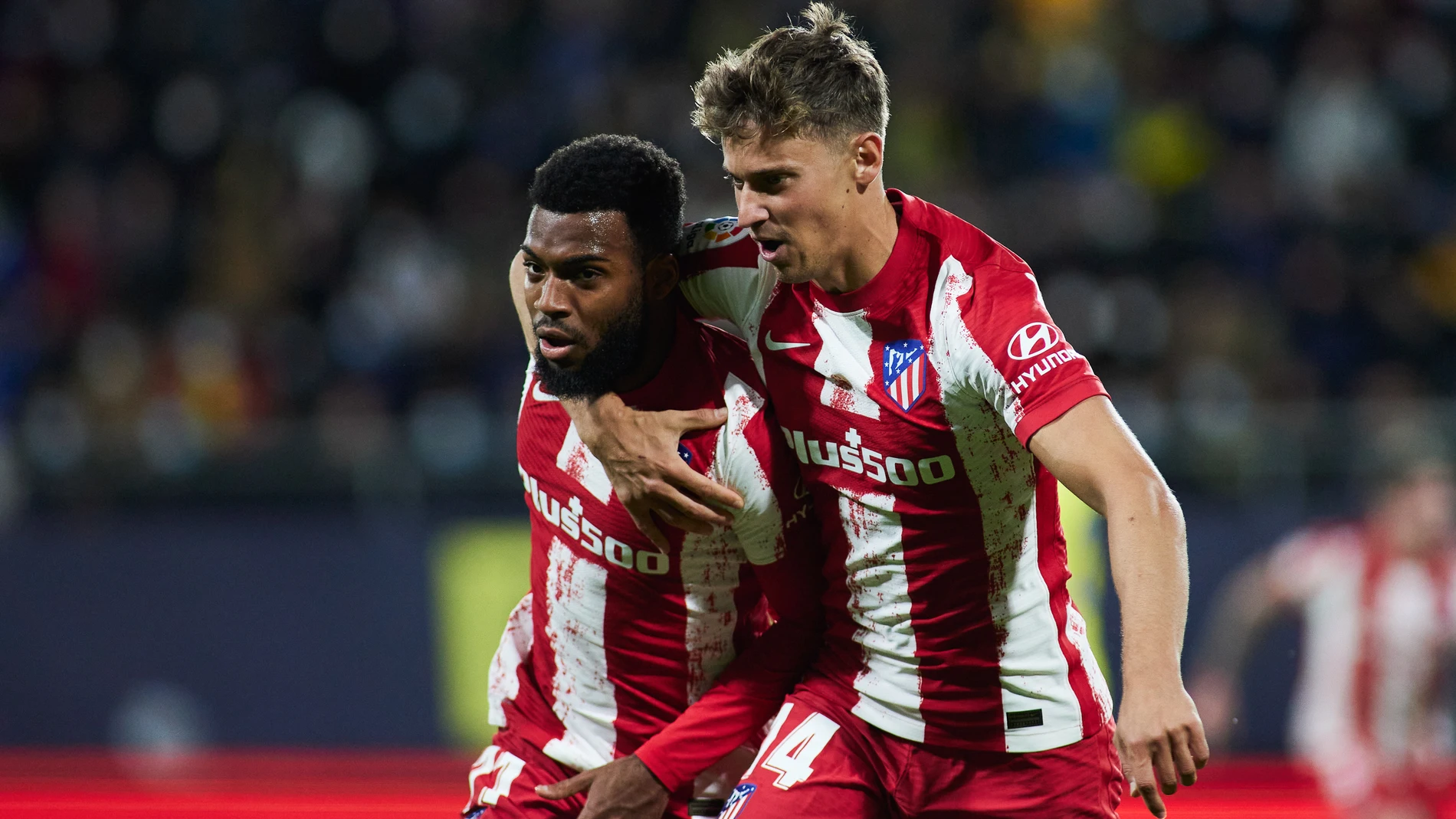 Llorente y Lemar celebran el primer gol del Atlético