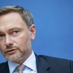 Christian Lindner,designated German Minister of Finance, speaks at a news conference in Berlin, Germany, Tuesday, Dec. 7, 2021 The leader of the pro-business Free Democrats will hold the government's purse strings as finance minister. Lindner dominates his party, which he led back into parliament in 2017 after a four-year absence. (Bernd Von Jutrczenka/dpa via AP)
