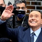FILE PHOTO: Italy's former Prime Minister Silvio Berlusconi waves after he voted in Italian elections for mayors and councillors, in Milan, Italy, October 3, 2021. REUTERS/Flavio Lo Scalzo/File Photo